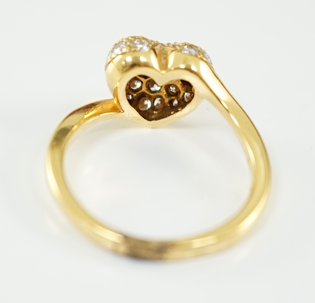 A modern Cartier 18ct gold and pave set diamond heart shaped ring